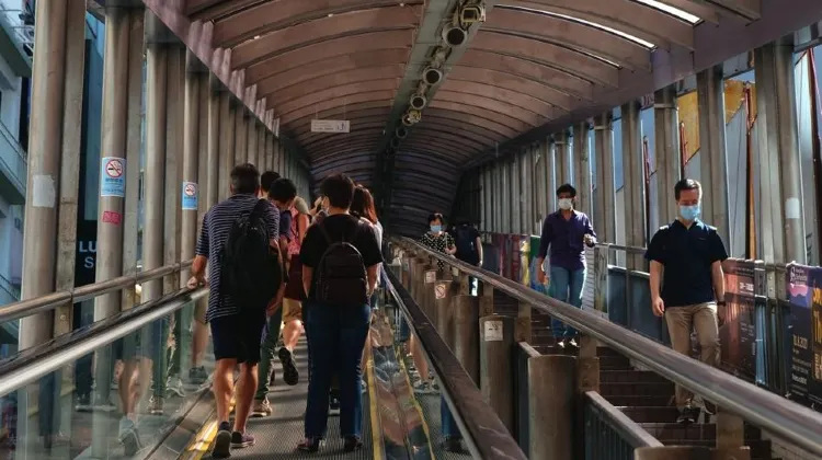 People walking down a flight of stairsDescription automatically generated with low confidence
